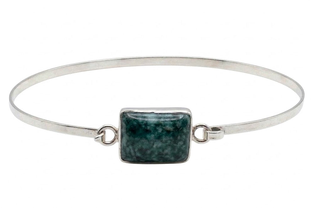 Guatemalan jadeite jade bracelet against white background 