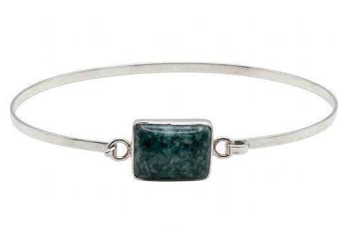 Guatemalan jadeite jade bracelet against white background 