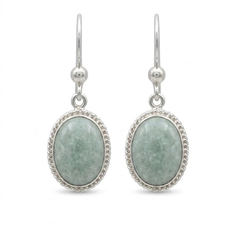 Silver earrings with light green jade on a white background