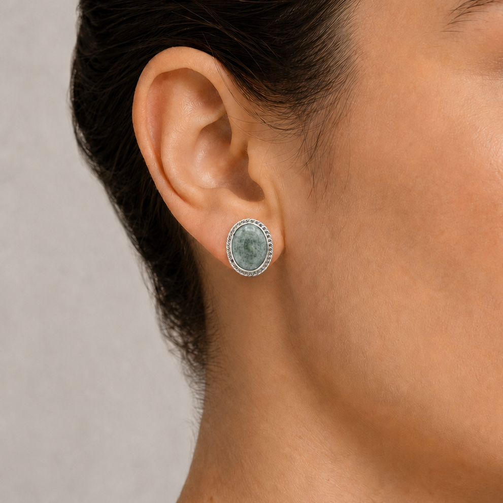 Close-up of a woman wearing green jade earring 