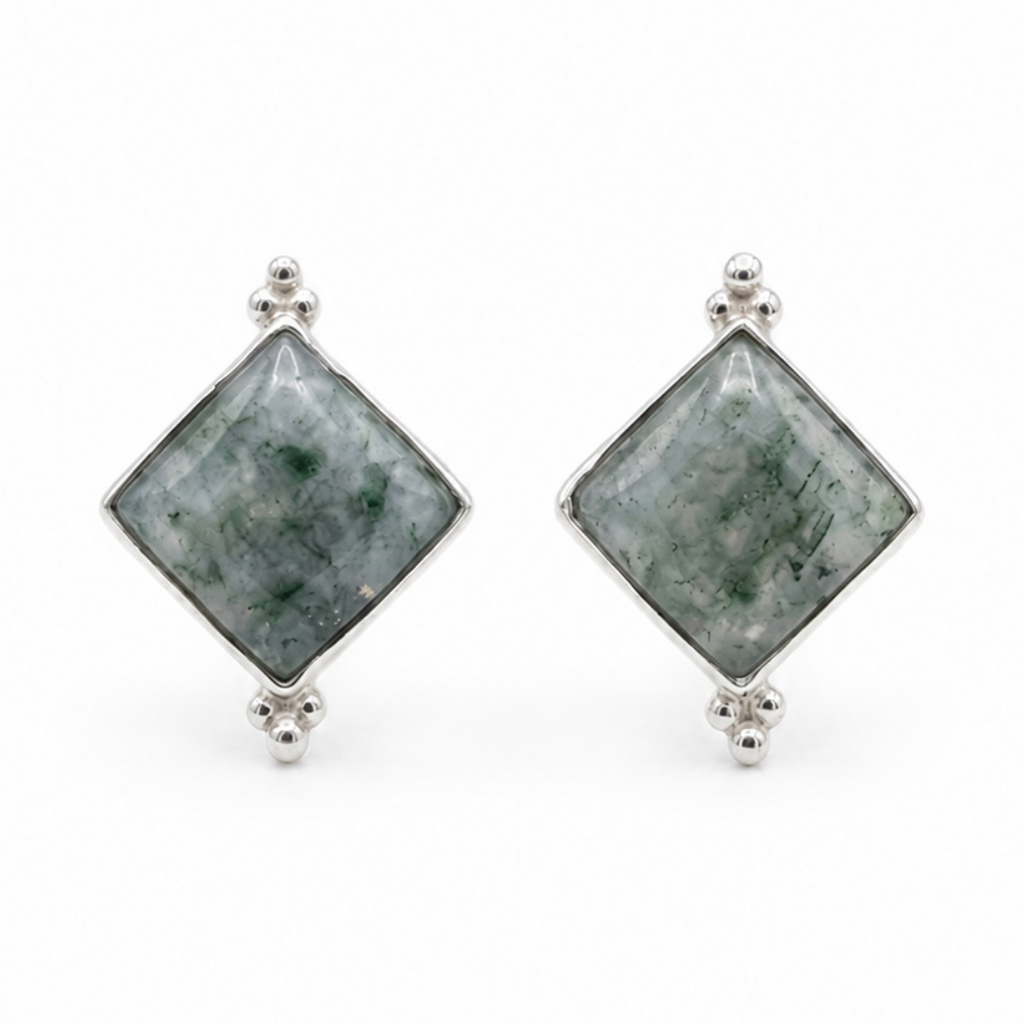 pair of moss jade earrings against a white studio background 