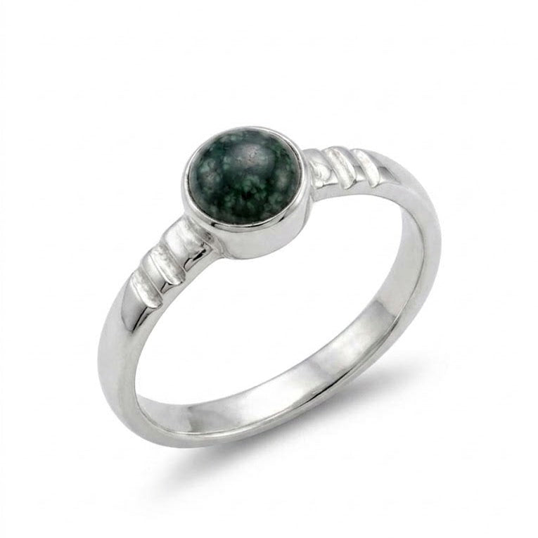 Silver ring with a jade stone on a white background