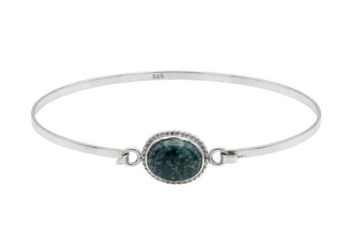 Silver bracelet with a green jade stone on a white background