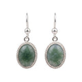 Pair of silver earrings with princess jade on a white background